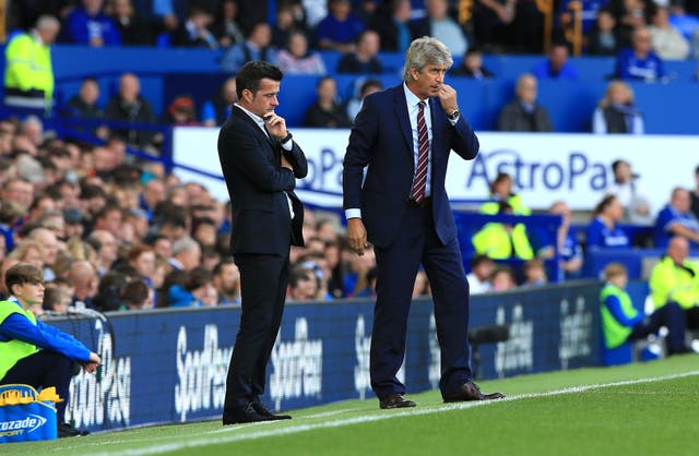 Manuel Pellegrini (right) on the touchline at Everton. (PA)