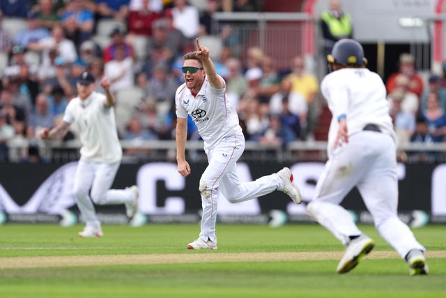 Liam Dawson (centre) struck with his seventh delivery