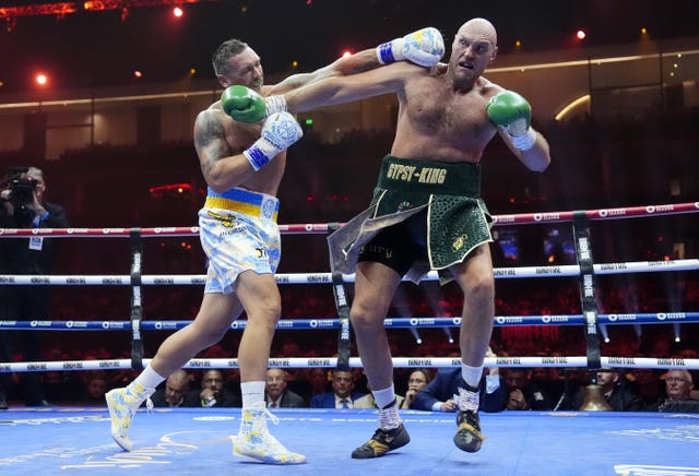 Oleksandr Usyk lands a punch on Tyson Fury