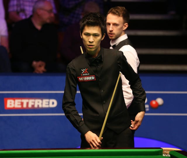 Thepchaiya Un-Nooh, foreground, and Judd Trump