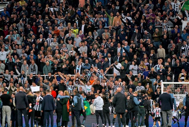 Newcastle fans celebrate at the end of the game