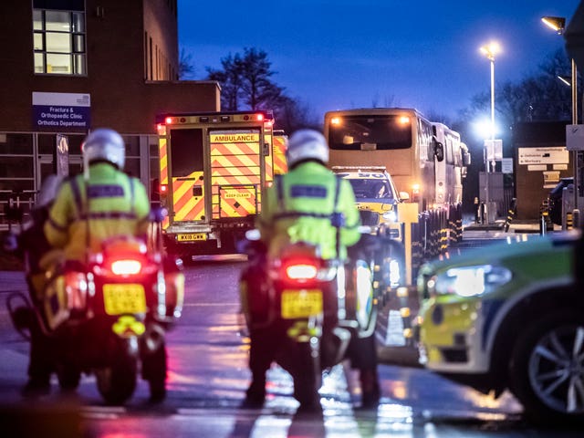 Coaches carrying passengers who were repatriated from Japan