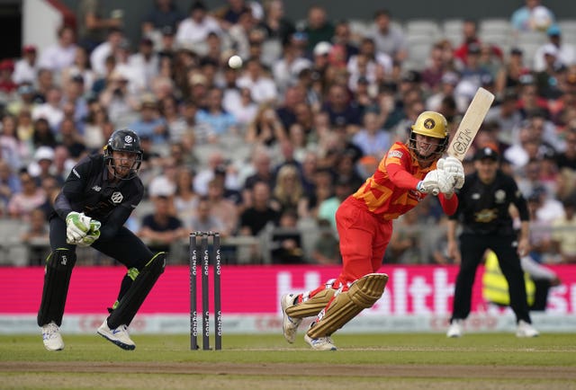 Birmingham Phoenix's Miles Hammond (right) and Manchester Originals' Jos Buttler in action during The Hundred match at Old Trafford