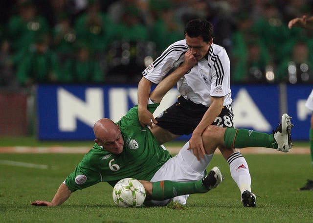 Irishman Lee Carsley (left) fights against German Piotr Trochowski