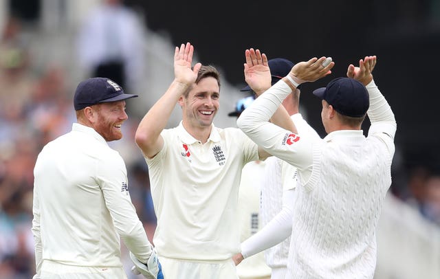 Chris Woakes, centre, could be a part of England's quest for glory on two fronts this summer (Tim Goode/PA)