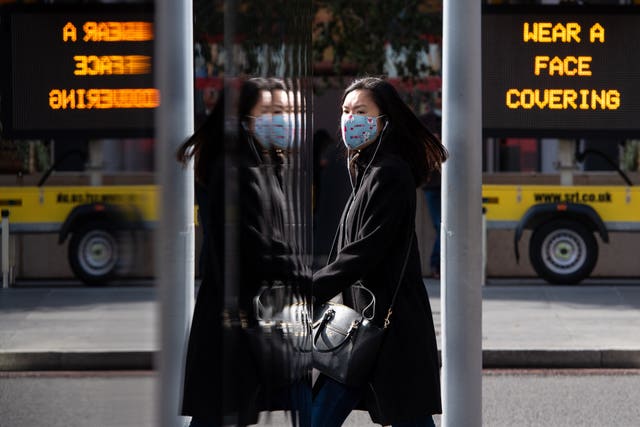A woman in a face mask