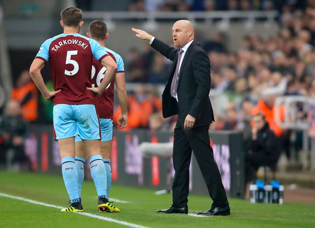 Sean Dyche, right, is planning for James Tarkowski, left, to remain at Burnley (Owen Humphreys/PA)
