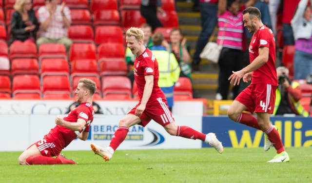 Anderson, left, celebrates his late equaliser against Rangers