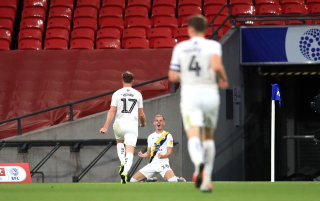 Mark Sykes (centre) celebrates Oxford's leveller
