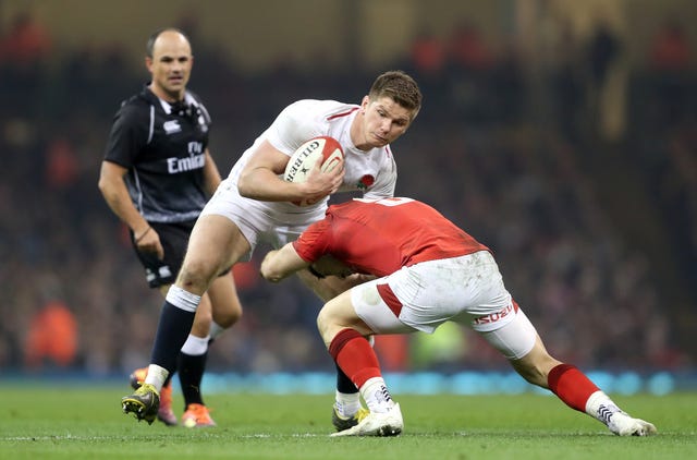 England captain Owen Farrell (left) in action during the Six Nations defeat away to Wales.