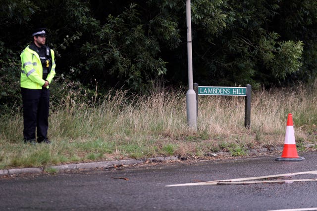 A police officer closes off Lambdens Hill