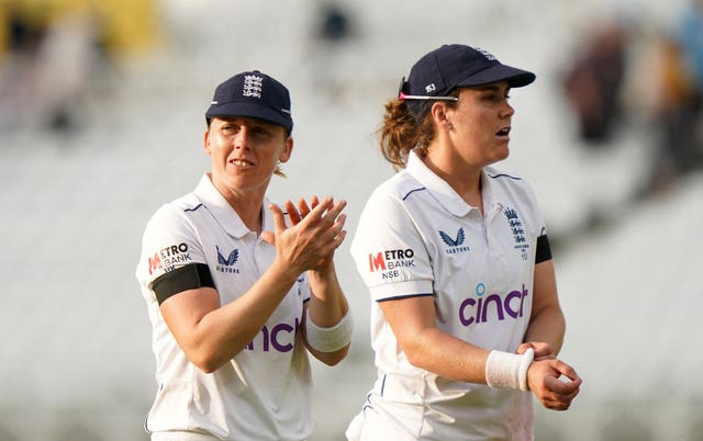 England's Heather Knight, left, and Nat Sciver-Brunt walk off at the end of play in a Test match against Australia