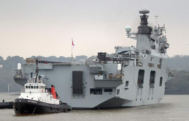 HMS Ocean, the Royal Navy's fleet flagship as she makes her way to HM Naval Base Devonport, Plymouth after six months on operations (Andrew Matthews/PA)