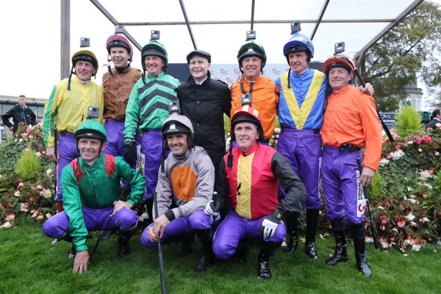 Pat Smullen poses with the jockeys in the parade ring at the Curragh