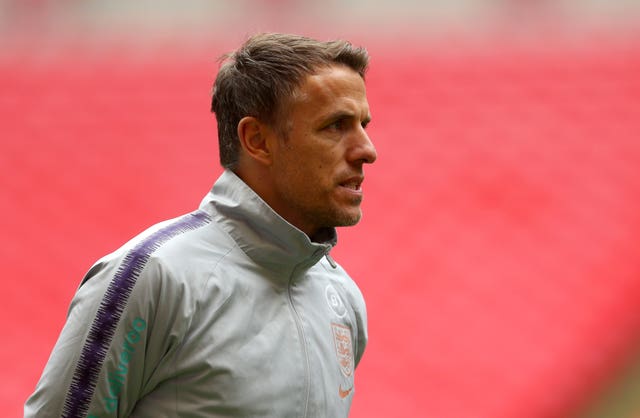 Phil Neville's England face Germany away on October 27 (Steven Paston/PA).