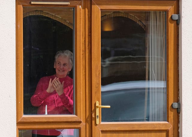 A resident enjoys the performance