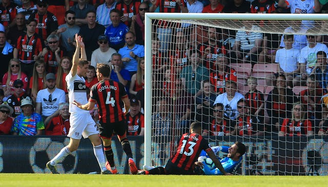 Sergio Rico, right, saves from Callum Wilson