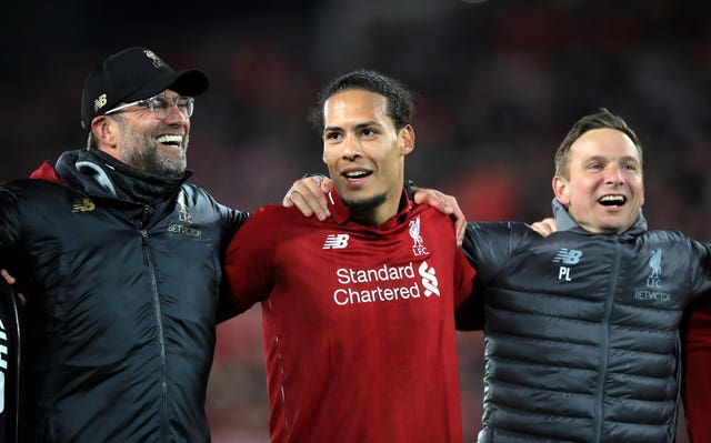 Virgil Van Dijk celebrated with Jurgen Klopp on the pitch at Anfield