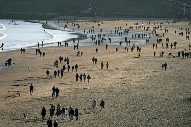 People walking on Tynemouth beach, Tyne and Wear, during November's lockdown (Owen Humphreys/PA)
