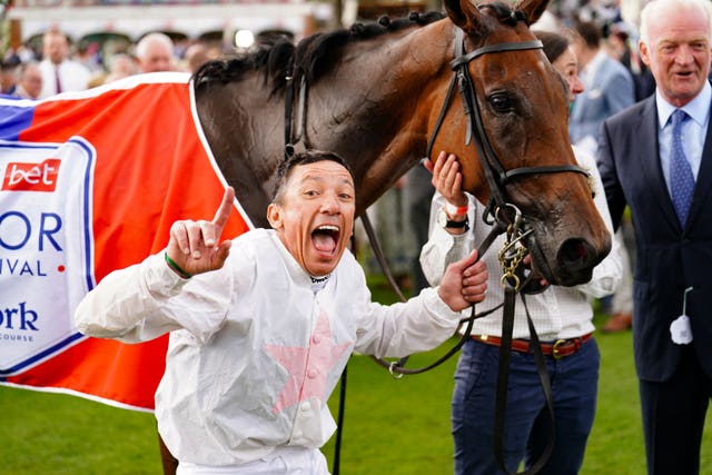 Willie Mullins looks on as Frankie Dettori celebrates Ebor glory