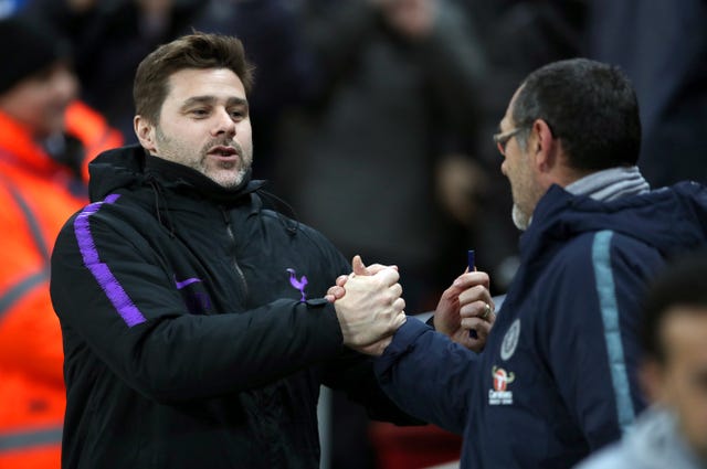 Maurizio Sarri (right) has warned Mauricio Pochettino's Tottenham that their Champions League spot is under threat