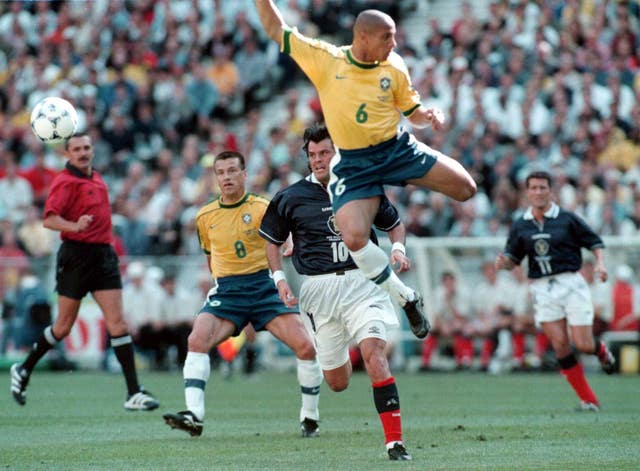 Brazilian Roberto Carlos (centre) admits he does not know how he scored his banana-shot free-kick (Owen Humphreys/PA)