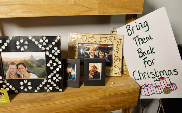 Photos of Richard Ratcliffe and his wife Nazanin Zaghari-Ratcliffe, who has been jailed in Iran, on display at their home in north London (John Stillwell/PA)