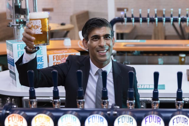 Rishi Sunak behind the bar