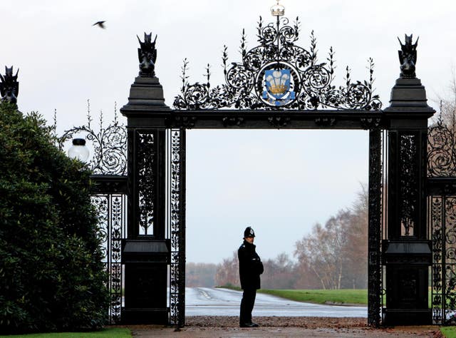 A police officer stands at the gates to Sandringham House (Chris Radburn/PA)