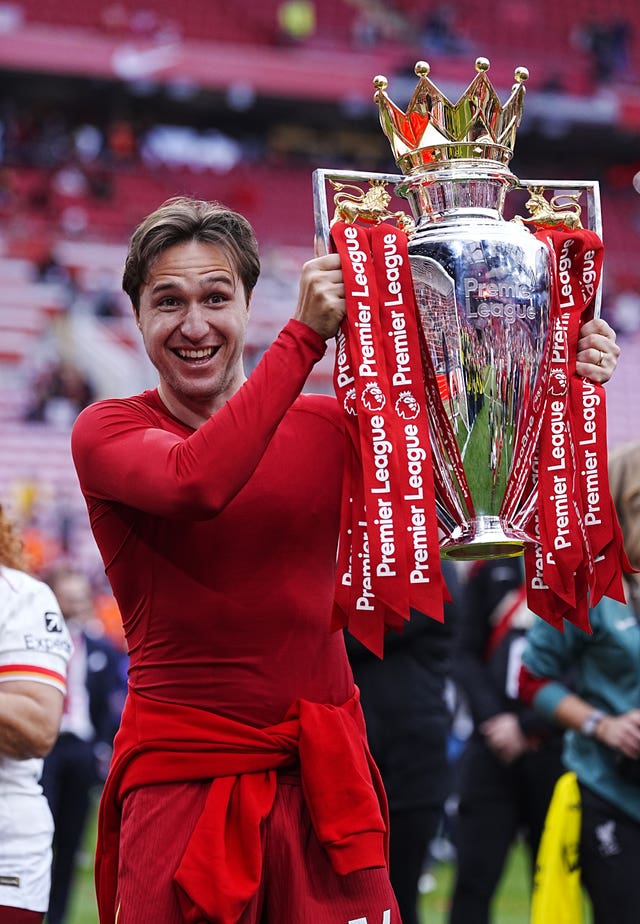 Liverpool’s Federico Chiesa celebrates with the Premier League trophy