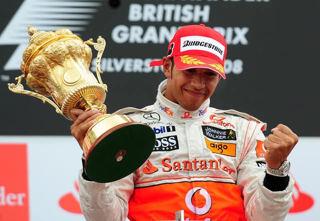 McLaren's Lewis Hamilton beams with delight after winning the British Grand Prix for the first time in 2008. He has won a record seven times at Silverstone, including six of the last seven races