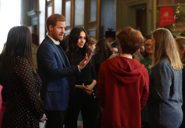 Prince Harry and Meghan Markle during a reception for young people at the Palace of Holyroodhouse in Edinburgh (Andrew Milligan/PA)