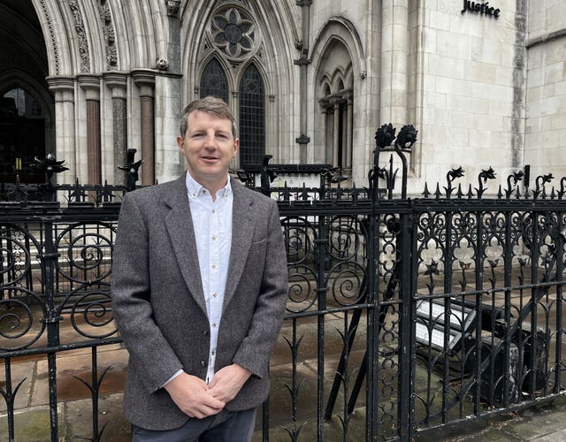 Dr Aidan Kelly outside the Royal Courts of Justice