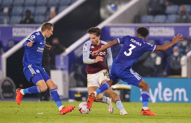 Aston Villa’s Jack Grealish battles for the ball with Leicester’s Timothy Castagne and Wesley Fofana