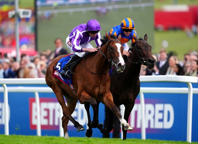 Minnie Hauk (left) winning the Oaks at Epsom last year (