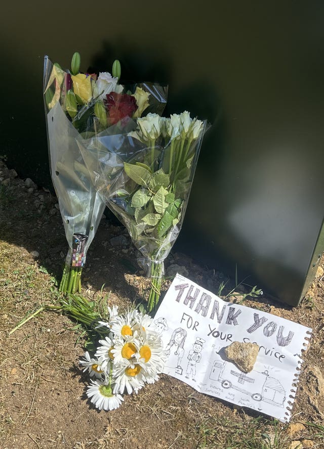 Flowers and messages left outside Bicester Motion