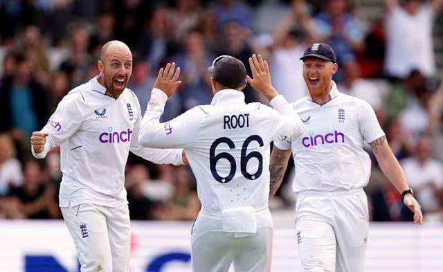 Ben Stokes (right) celebrates with Jack Leach and Joe Root at Headingley