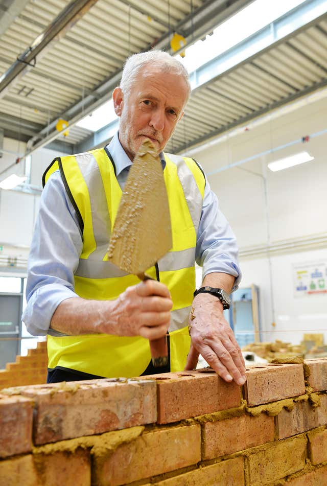 Labour leader Jeremy Corbyn has a go at bricklaying