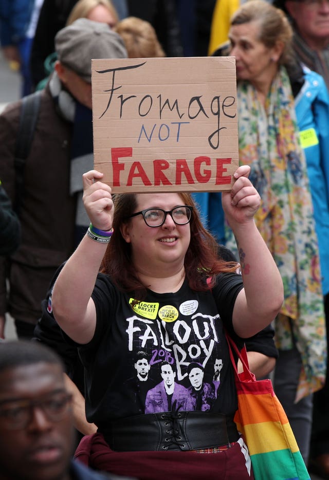 One protester holds up a sign that reads: Fromage not Farage (Yui Mok/PA)