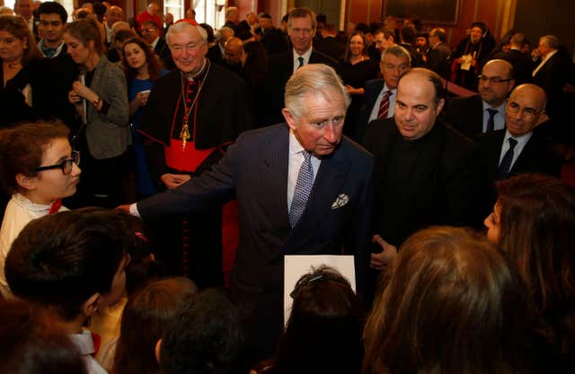 The Prince of Wales speaks to members of the Iraqi Chaldean Catholic community children’s choir in 2015 (Alastair Grant/PA)