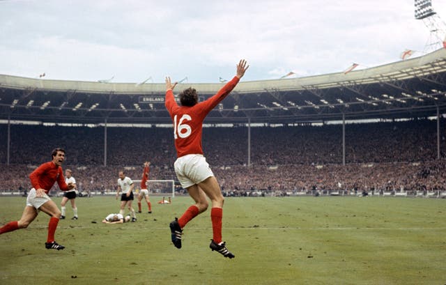 Martin Peters celebrated what England thought would be the goal to win the World Cup