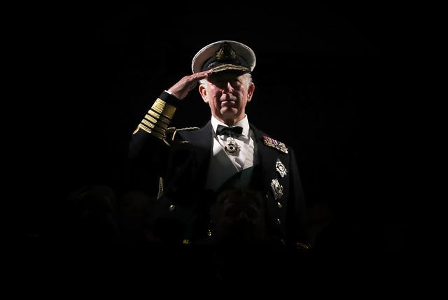 The Prince of Wales, known as the Duke of Rothesay in Scotland, takes the salute during the Royal Edinburgh Military Tattoo at Edinburgh Castle (Jane Barlow/PA)