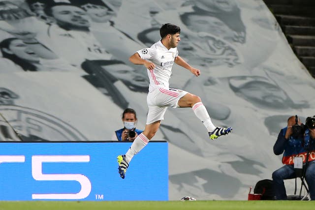 Marco Asensio celebrates scoring for Real