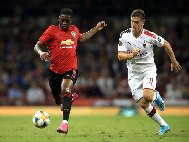 AC Milan's Krzysztof Piatek, right, has been linked with Tottenham