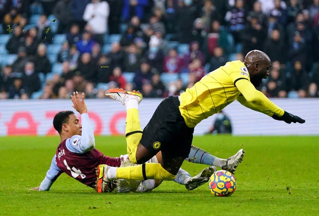 Romelu Lukaku, right, is fouled in the box by Ezri Konsa