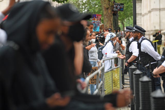 Protesters took to the the gates outside Downing Street (Victoria Jones/PA Wire)