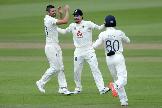 Mark Wood, left, averages 44.91 in home conditions compared with 20.76 in six overseas (Mike Hewitt/NMC Pool/PA)