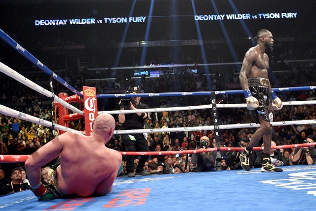 Deontay Wilder knocked down Tyson Fury twice as they drew a dramatic WBC heavyweight title fight in Los Angeles