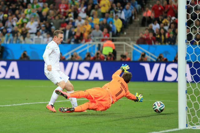 Wayne Rooney scores against Uruguay at the 2014 World Cup