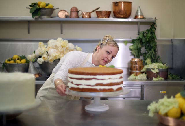 Claire Ptak puts finishing touches to the cake for the royal wedding (Hannah McKay/PA)